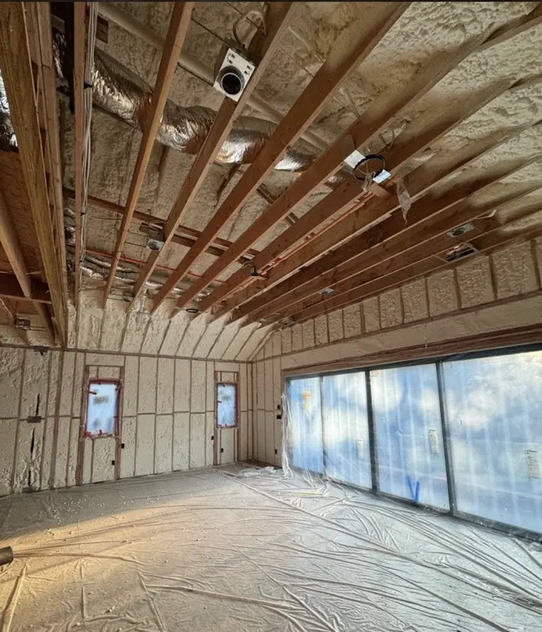 Interior walls and ceiling insulated with spray foam during new construction in North Cornwall